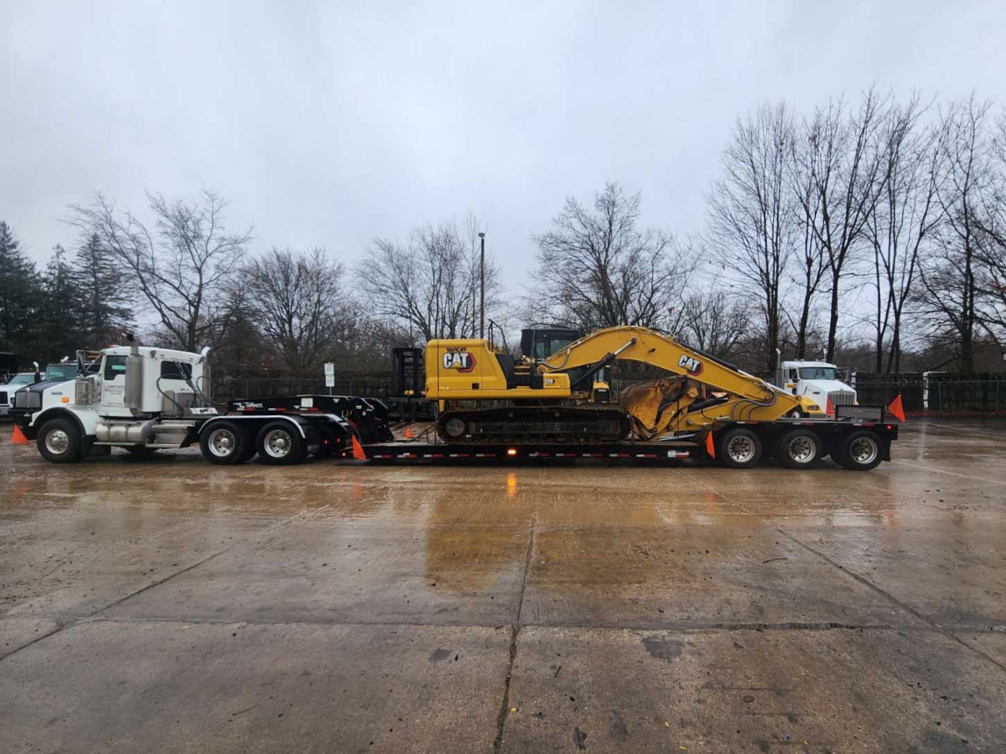 cat excavator on large trailer