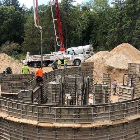 curved foundation being poured