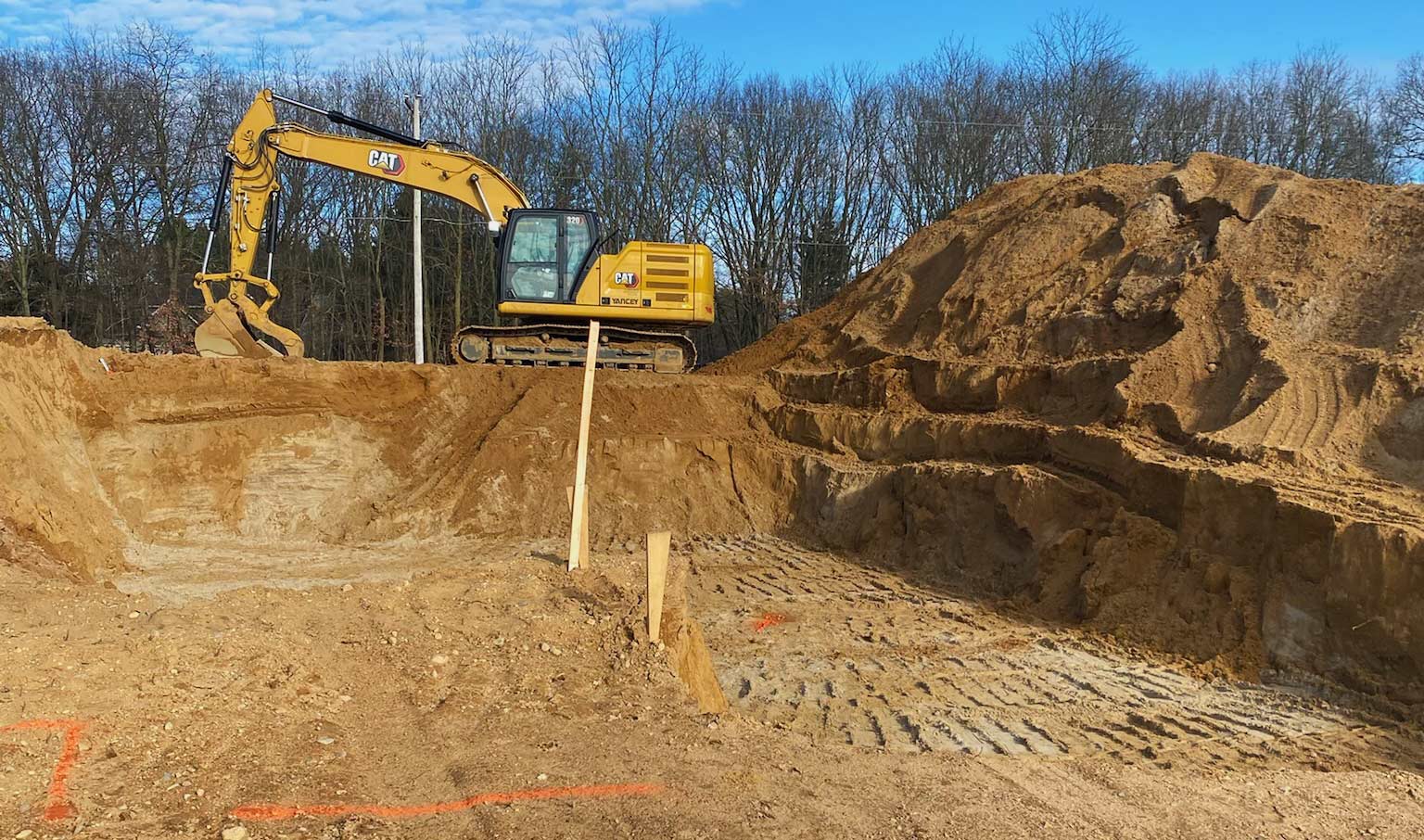 excavator doing excavation for basement