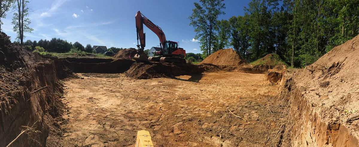 excavator digging new basement