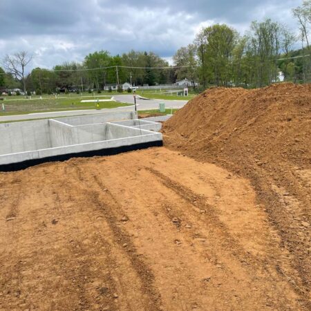 graded area in front of newly poured basement