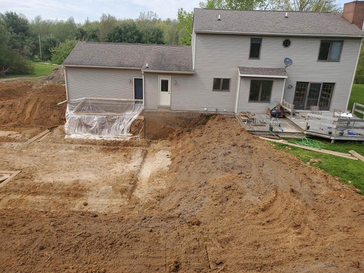 house with excavation being done for addition