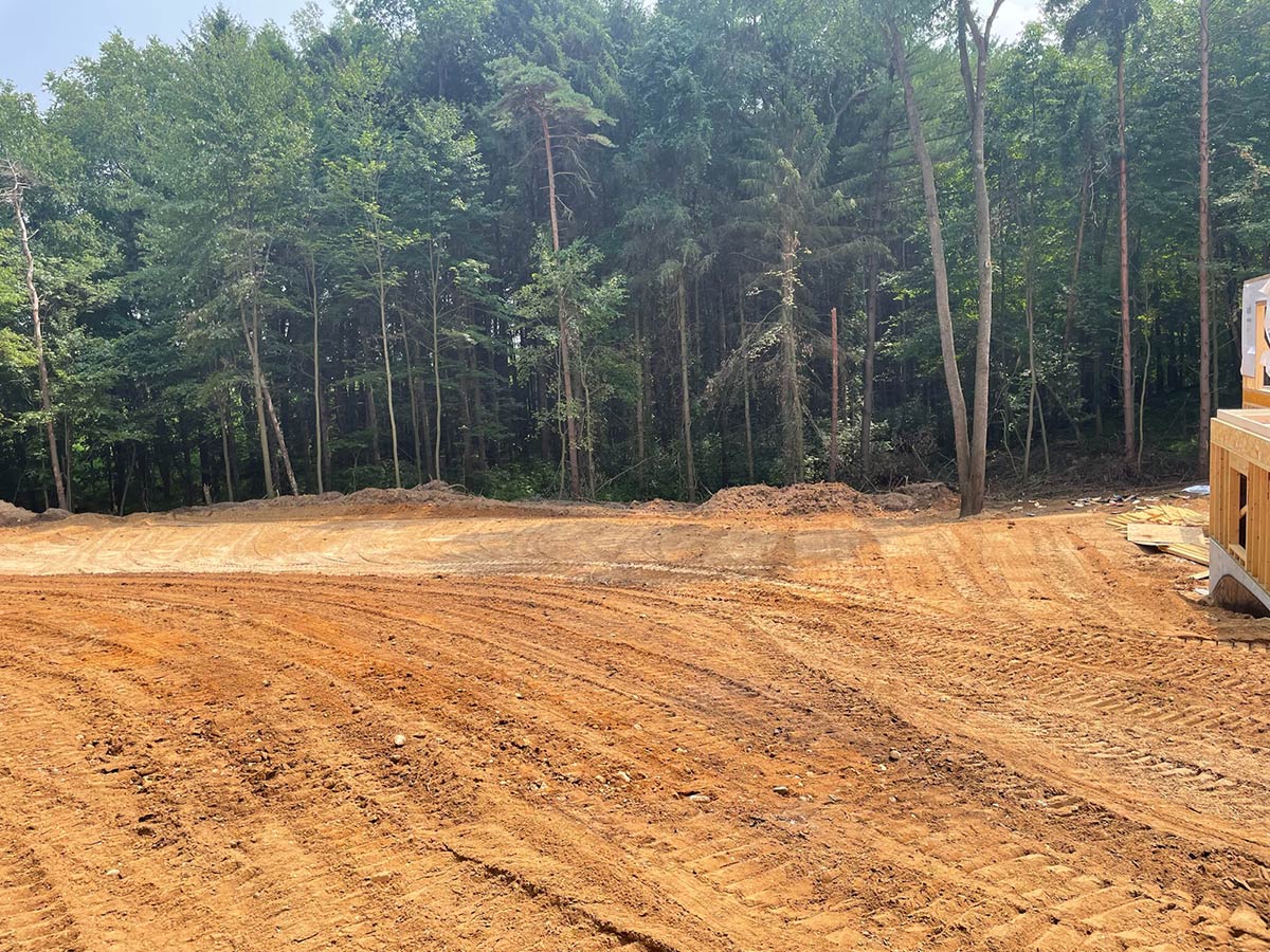 leveled land with trees in background