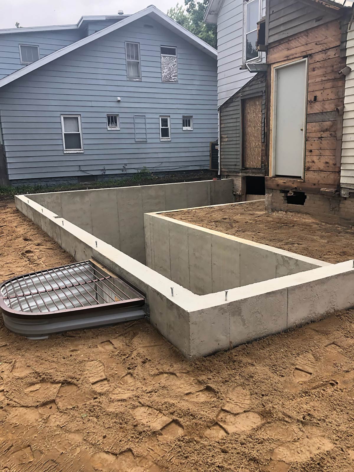 new concrete for addition with window well