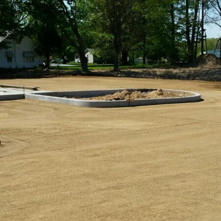 graded parking lot area with curbs