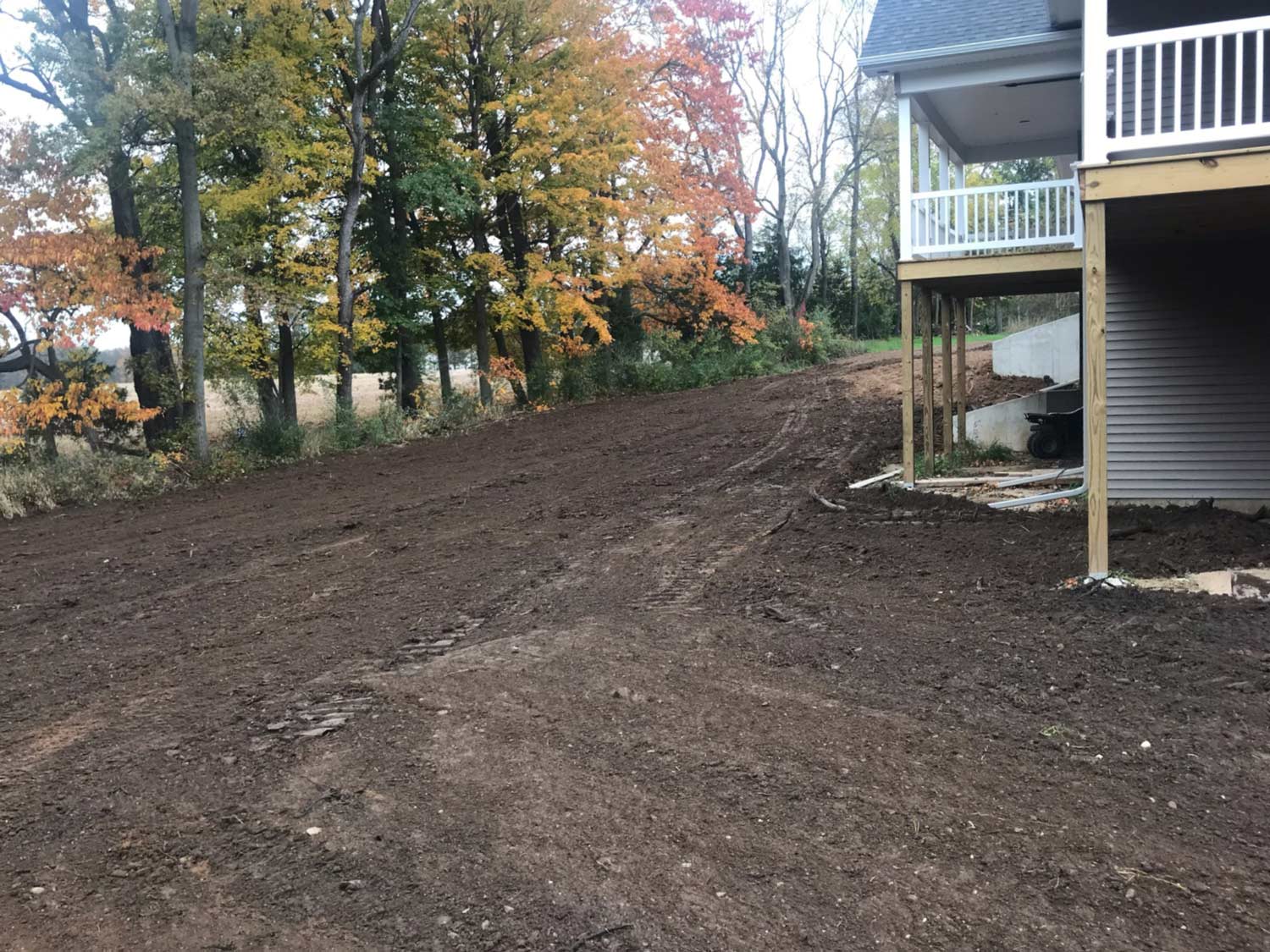 new home with topsoil grading around foundation