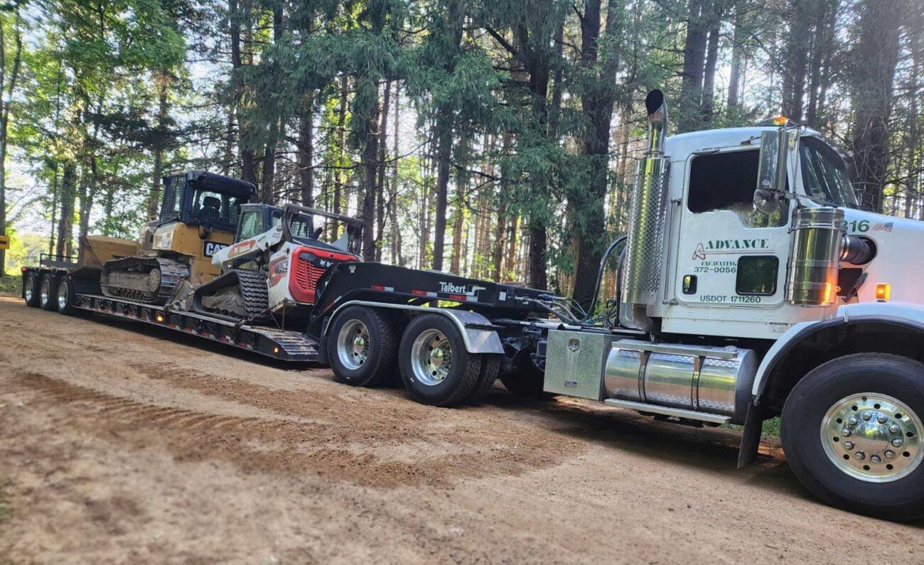 truck and trailer with excavating equipment